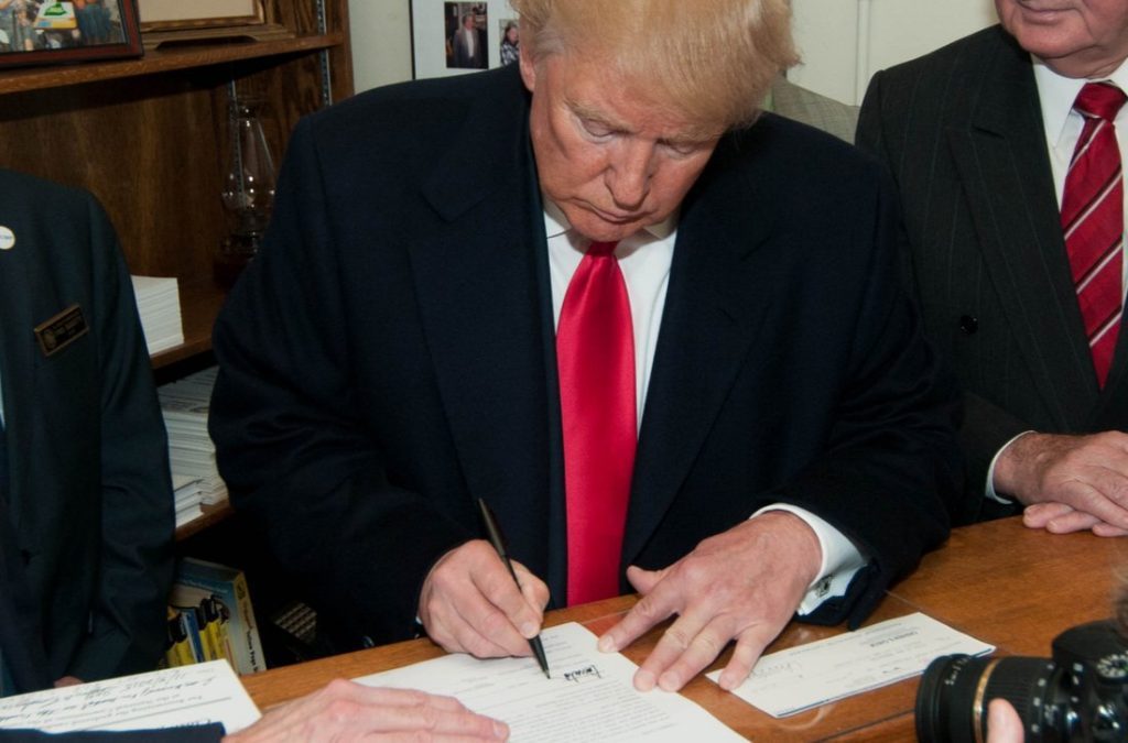 President Trump signing papers